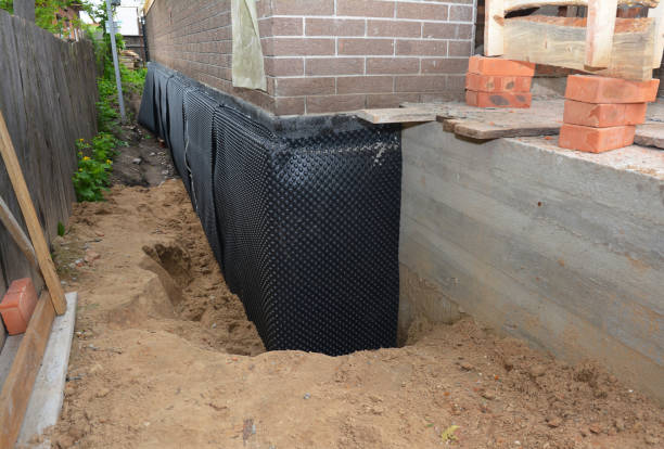 Happy homeowners after waterproofing job in Solsberry